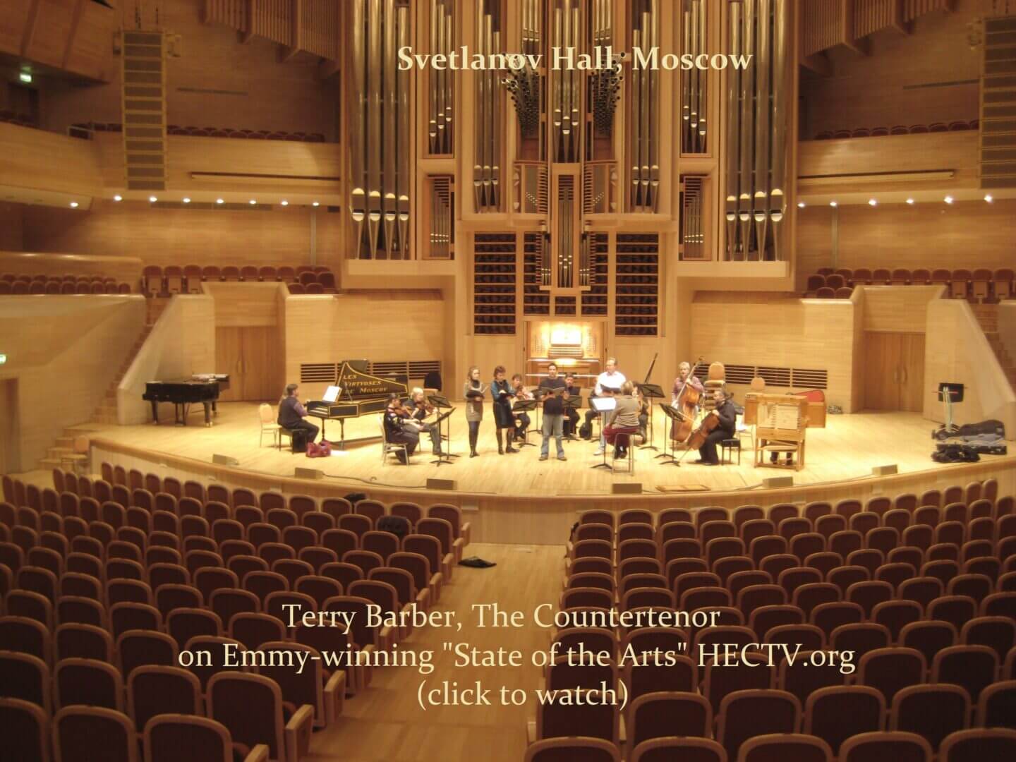 Orchestra performing on stage in Svetlanov Hall, Moscow.